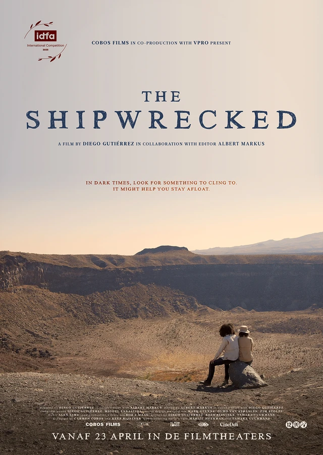 Poster for "The Shipwrecked" shows two people sitting on a rock, overlooking a vast crater.