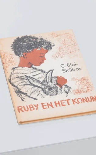 book titled "Ruby en het konijn" by C. Blei-Strijbos. cover illustration of a child holding a rabbit